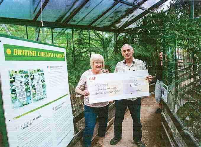 Jenny handing the cheque to Bernard Devaux. The